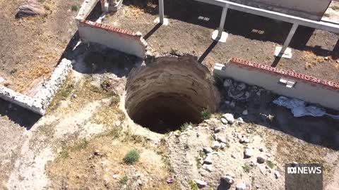 Turkey's mysterious craters swallowing up fertile farming land | ABC News