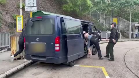 Video shows woman being forced into van at bus stop near Hong Kong prison