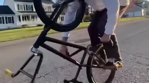 Man Rides Upside Down Bicycle