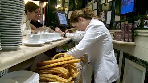 Churros and chocolate from San Gines are available on a laptop