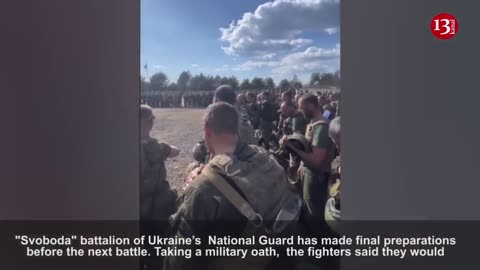 Taking an oath, soldiers of “Svoboda" battalion are preparing for an attack