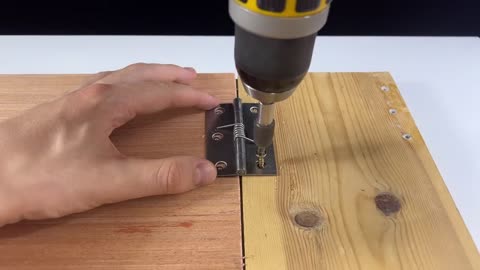 How to insert a spring into a door hinge