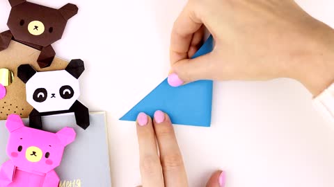Paper origami of a teddy bear and a panda.
