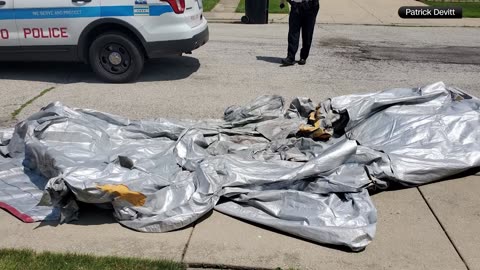 Airplane's emergency slide falls into Chicago backyard, investigation underway