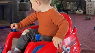 One-Year-Old Nods Off While Driving Toy Car
