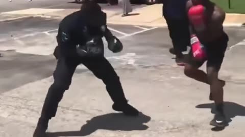 OMG! Policeman fights guy on street! Wow they got skills