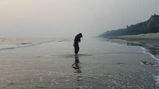 lonely girl on the sea