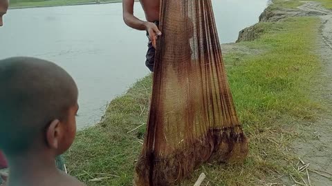 Village Fishing in the river with nets