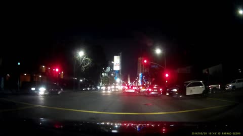 Driver Runs Red Light in Front of LAPD