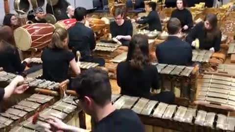 Victorian students demonstrate in action to play gamelan
