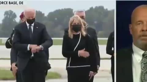 Biden checks the time during ceremony for Marines killed in Kabul