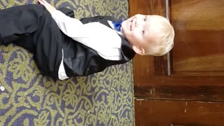 Toddler rocks out in a tux