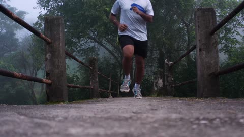 The Man Running on Hill Trail