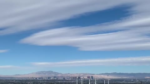 Hawk gliding easily over east Las Vegas.