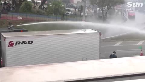 Brazilian police fire water cannons and rubber bullets at anti Lula protesters