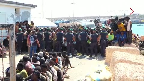 Invasion - Men from Africa trying to push their way into an Italian island of Lampedusa