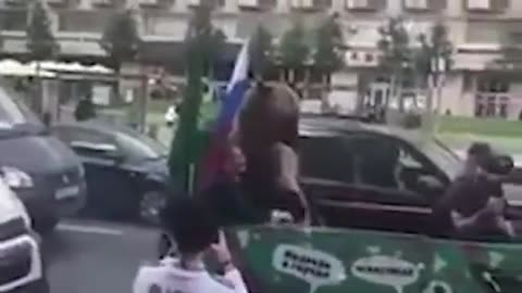 Fury at the World Cup's vuvuzela playing bear: Russian fans paraded a musical grizzly through