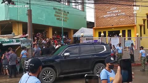 Residents of San Jose II Noveleta, Cavite wait outside Barangay Hall to receive assistance from DSWD