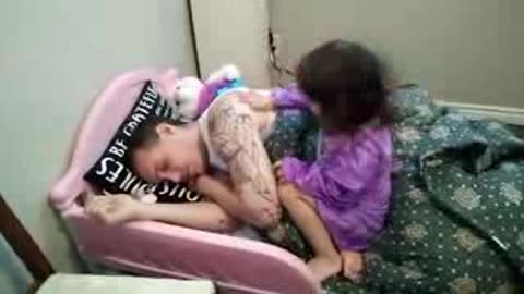 Evil little girl puts daddy to sleep her way!