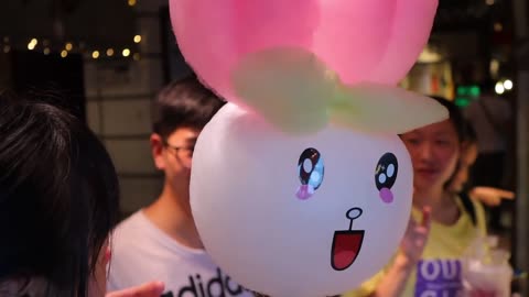 Cotton candy made of colorful pieces / cotton candy art - street food