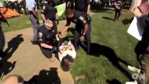 1A? Cops Take Down Professor Protesting War