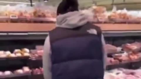 Muslim Migrant Pissing on Pork In Netherlands