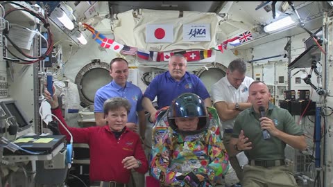 Space Station Crew Unveils Space Suit Designed by Cancer Patients on Earth