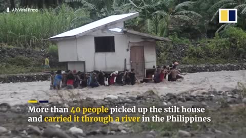 Men pick up and move neighbour’s house to avoid flash flooding in central Philippines