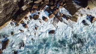 Waves crashing on rocky beach