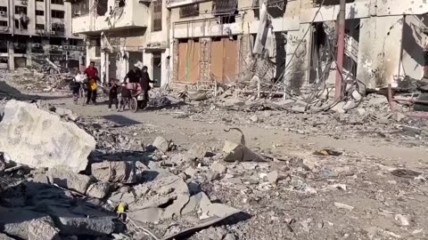Residents of Gaza City neighborhood return to find homes destroyed by Israeli bombardment.mp4