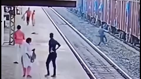 Cam footages of man save a person from railway tracks