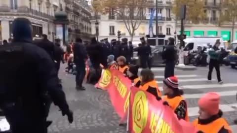 Tensions flare in Paris as drivers confront environmental activists blocking iconic avenue