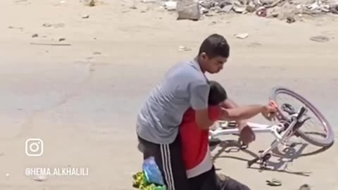 Brave young Palestinians rescued a sniped civilian in Alwehda street.