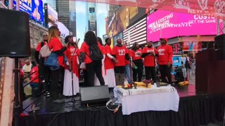 Time Square NYC The God is love takeover singing the gospels