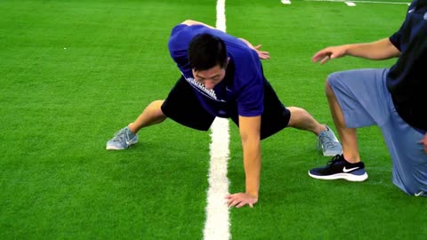Strength Training Tips - How to do One-Arm Push Ups - Coach Alex Fotioo and Kenton Lee