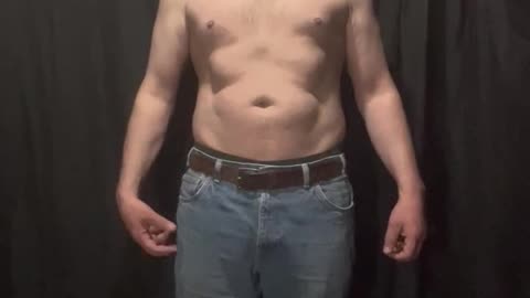 Fat man flexes his flab 5 of 14