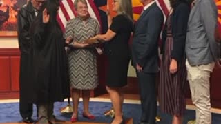 Katie Hobbs can’t stop laughing while taking her oath