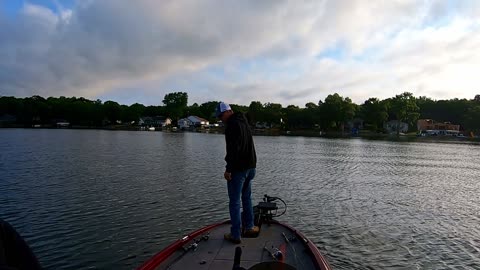 Muskie Fisherman Catching Bass