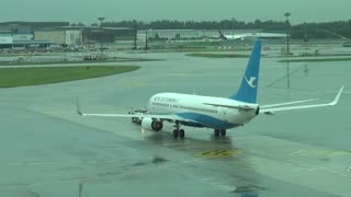 Boeing 737-800 B-5827 performs its pushback before takeoff