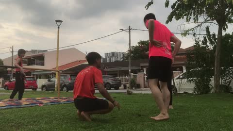 Guy Faceplants To The Grass After Attempting An Assisted Backflip