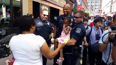 Little Girl Hugs Cops Outside of RNC Convention