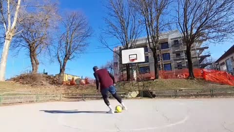 Guy Lands a Rainbow Flick Trick Shot in Basketball Net