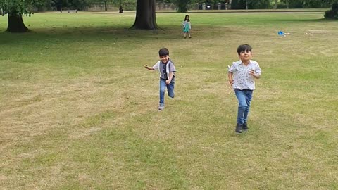 My kids racing in the park