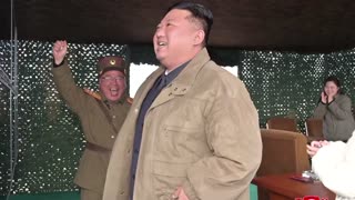 North Korea's Kim reveals daughter at missile test