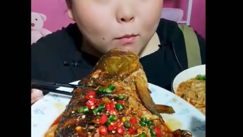 Funny Girl Eating Very Spaicy Fish Without Break