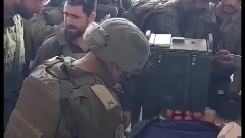 IDF Soldiers on break during a mission reading the Torah in Gaza