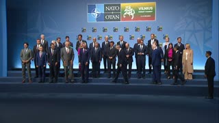 World leaders pose for group photo at start of NATO summit