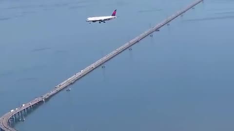 The plane appearing to be frozen mid-air is due to an optical illusion called “Parralax”