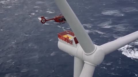 How access is gained to offshore wind turbines ~The sheer size difference compared to the helicopter