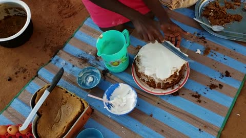 Baking my birthday cake in the village using sand